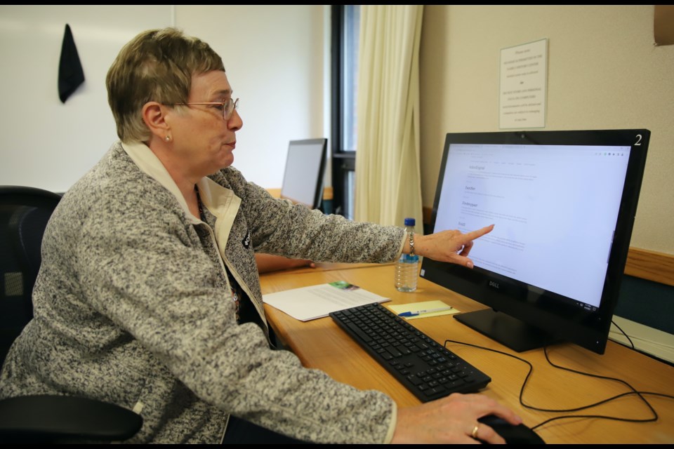 Olds FamilySearch Centre director Kim Welton scrolls through a list of websites available via the FamilySearch Centre.