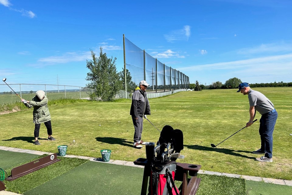 Golf Fore All participants at the driving range at the Innisfail Golf Club. The program's 40 participants were split into two groups by club professionals with their instructional time divided between the driving range, putting green and playing two holes of golf. Submitted photo