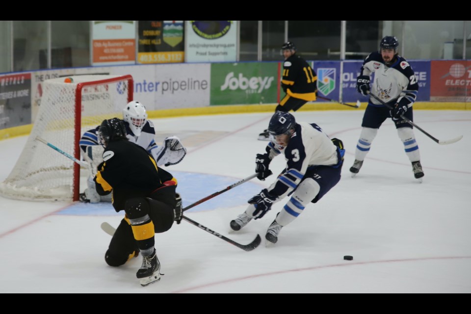 Everybody seems to lose sight of the puck in this part of a Sept. 7 exhibition game between the Olds Grizzlys and Canmore Eagles at the Olds Sportsplex. The Grizzlys were beaten 5-1 in that game, ending their six-game exhibition series with a 3-3 record. 
Doug Collie/MVP Staff