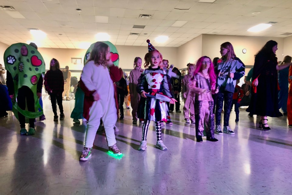 Kids in their best costumes dance during Friday's Halloween Howler