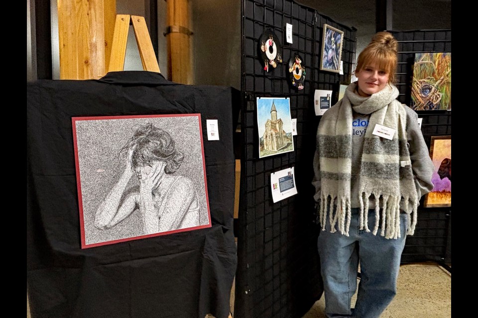 Mya Burton, a 15-year-old Grade 10 student at Innisfail High School, beside her trio of art works at the annual Innisfail Art Show and Sale at the Innisfail Library/Learning Centre on Nov. 15 and 16. 
Johnnie Bachusky/MVP Staff