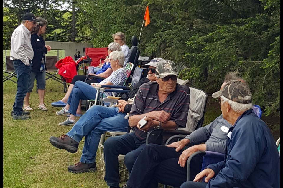 Early arrivals enjoying the sunshine at the 10th annual 46A Street Crescent Block Party in Innisfail. Submitted photo