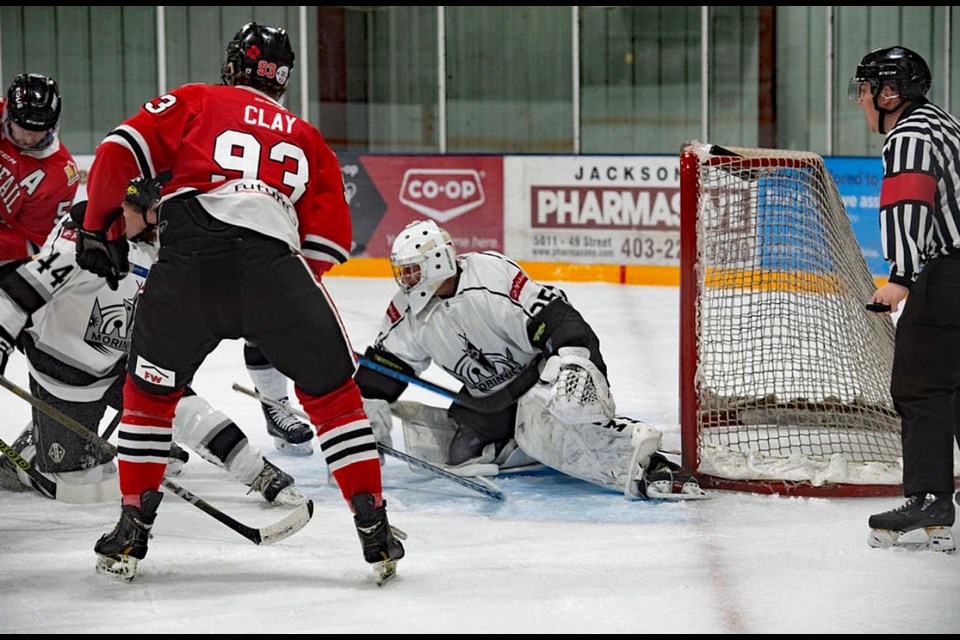 The Innisfail Eagles buzz around the Morinville Kings' net during a blowout 8-0 victory at the Innisfail Twin Arena on Nov. 10. Photo by Tasha Busch