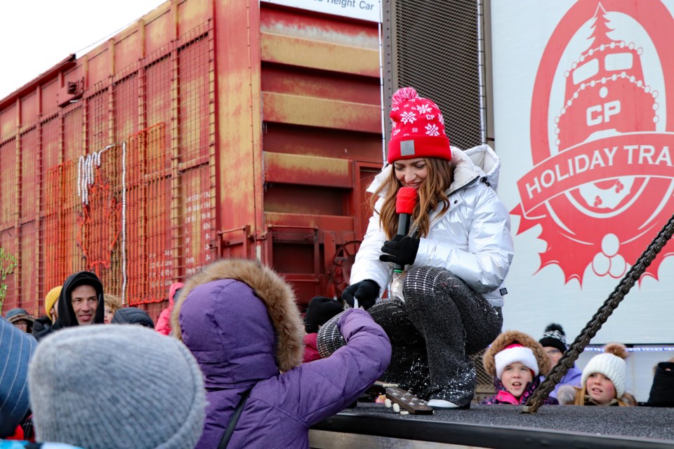 Grand Prairie's Tenille Townes signs autographs for the young during her powerhouse CP Holiday Train performance in Innisfail on Dec. 10. The holiday train, which came to the region for the first time since 2019, later stopped in Olds and Didsbury. Johnnie Bachusky/MVP Staff