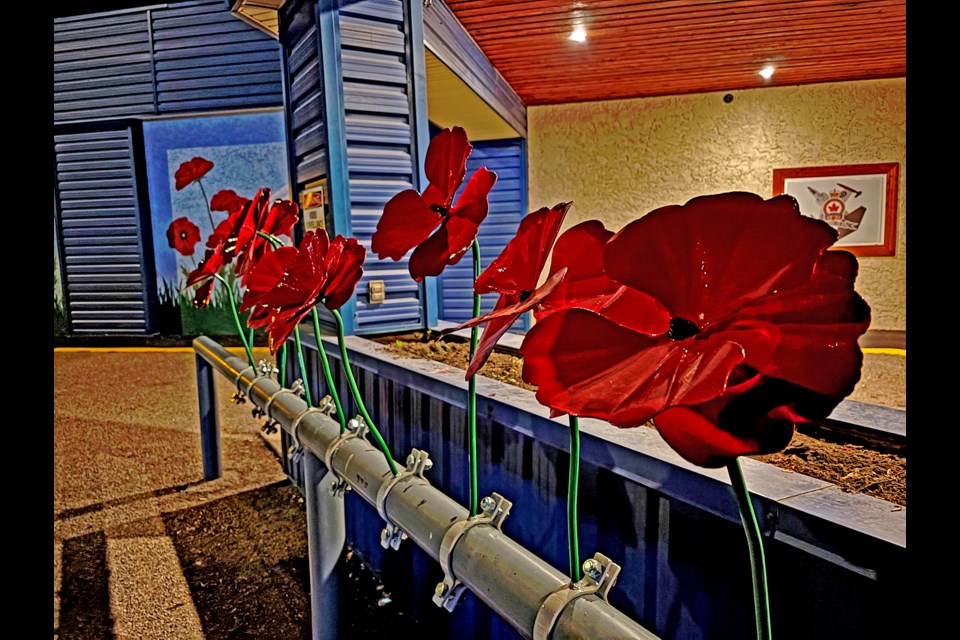 The 12 metallic poppies created by Bilton Welding and Manufacturing Ltd. are just outside the main entrance of the Innisfail Royal Canadian Legion Branch #104. This spring a bike rack, also created by Bilton, will be installed under the poppies. Johnnie Bachusky/MVP Staff