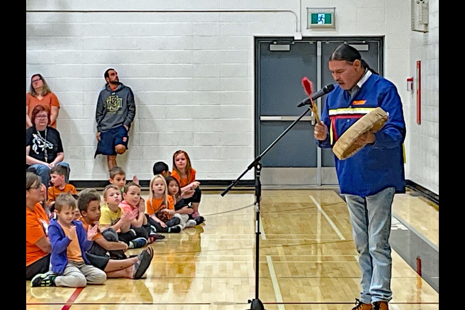 Dean Allen Johnson, an indigenous knowledge keeper and cultural adviser, beats his drum for a song on Orange Shirt Day on Sept. 29 for students and staff at Innisfail's St. Marguerite Bourgeoys Catholic School. Johnnie Bachusky/MVP Staff  