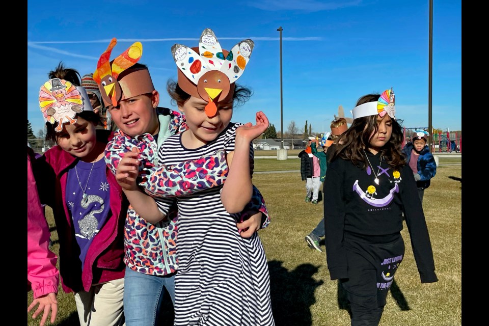 A group of Grade 4 students at Innisfail's St. Marguerite Bourgeoys Catholic School have fun on the school's inaugural Turkey Trot Day on Oct. 6.  St. Marguerite celebrated the initiative to mark the Thanksgiving weekend and to ensure 12 special school families had a joyous and unforgettable holiday with donated turkeys and hams. Johnnie Bachusky/MVP Staff