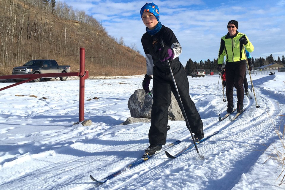 Reece Kinnear, 9, who lives on an acreage west of Olds, followed by Bryan McBain, a member of the Sundre Bike n’ Ski Club and instructor with the group’s Jackrabbits program, was among about two dozen youths improving their cross-country skiing technique at Snake Hill in Sundre on Sunday, Jan. 15.
Simon Ducatel/MVP Staff