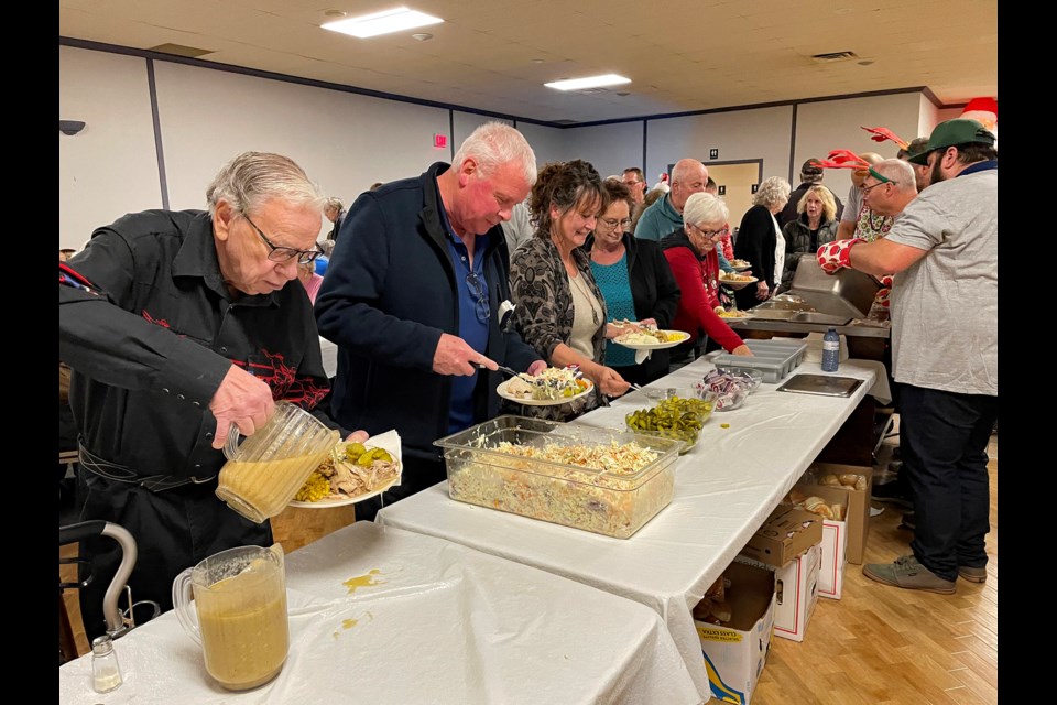 Shortly after doors opened at 4:30 p.m. on Dec. 13 at the Innisfail Royal Canadian Legion Branch #104 there was a long line-up at the turkey dinner buffet for Johns Manville’s 6th annual Family Christmas Turkey Dinner. Johnnie Bachusky/MVP Staff