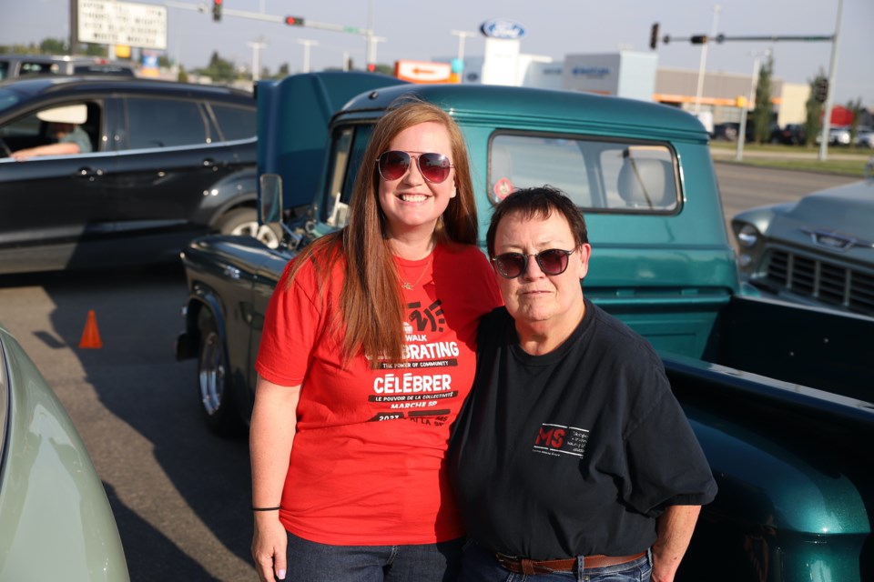 Olds residents and MS patients Joy Cavin, left; and Carole Thomas were on hand for the Cruise Night and Burgers to Beat MS at the A & W in Olds. Both say advancements in fighting the disease have made a huge difference in their lives. 