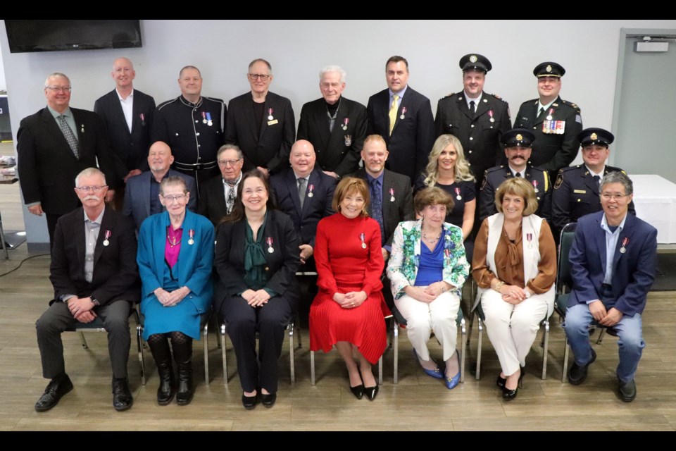 Red Deer-Mountain View MP Earl Dreeshen (back row-left) and the 21 regional citizens who received a King Charles III Coronation Medal at a gala event on March 1 at the Innisfail Golf Club. Johnnie Bachusky/MVP Staff