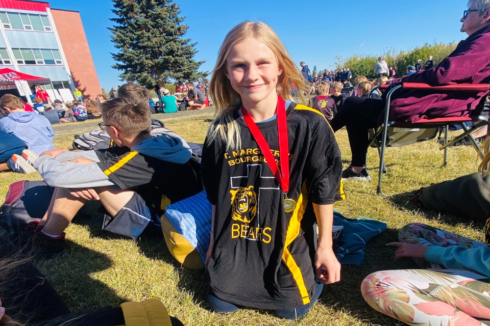 Innisfailian Lily Glazebrook has won a gold medal in her first competitive cross-country running event, and a first title for St. Marguerite Bourgeoys Catholic School in an individual sport. Submitted photo