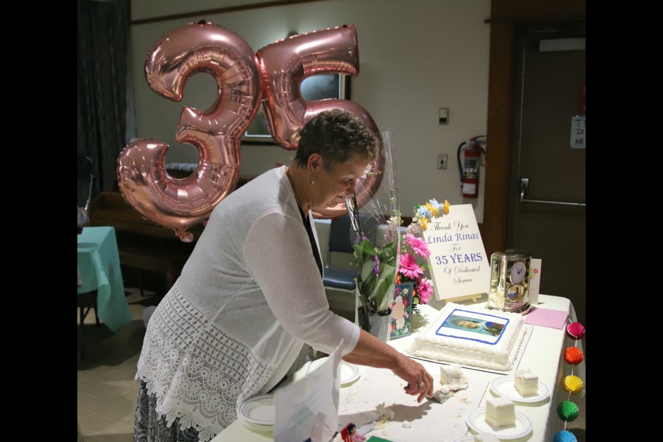 Linda Rinas, who has worked and volunteered at the Royal Canadian Legion Branch #105 in Olds for 35 years, was feted May 16 for all those years of dedication and assistance. She cut up and passed out slices of cakes for the occasion to those who came by to show their appreciation for her.
Doug Collie/MVP Staff