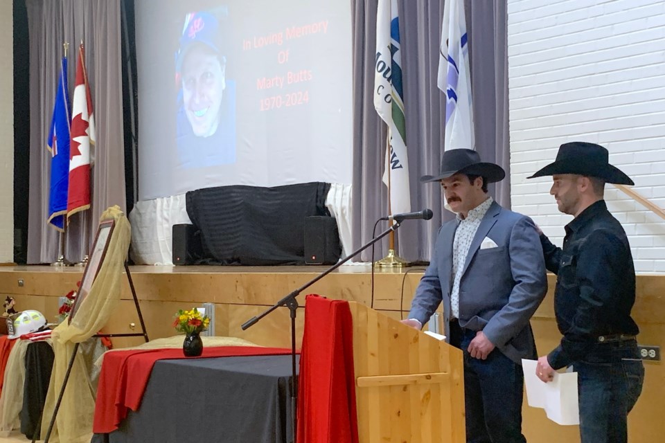 Matt and Peter Couillard, nephews of the late Marty Butts, were among those to share some heartfelt memories on Saturday, March 15 at the Sundre Community Centre during a celebration of life for the former Sundre fire chief who died this past November. “Marty came into our lives 20 years ago through our auntie Nicci. A thing that we will never forget is when we saw that amazing mullet,” said Peter to laughter, going onto recount stories of working and learning alongside Butts as he fought back tears.  
Simon Ducatel/MVP Staff