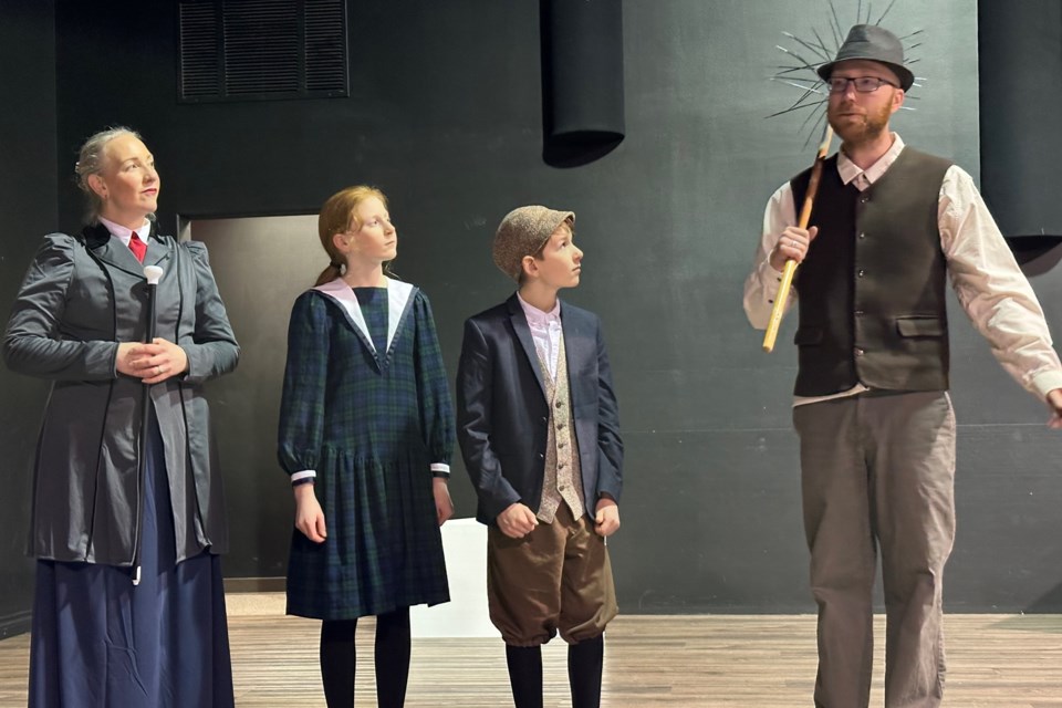 From left: Mary Poppins, played by Aryn Werezak; Jane Banks, brought to life by Ivy Saunders; Michael Banks, portrayed by Malachi Enns; and Bert the chimney sweep, whose role was taken on by Edwin vanderHelm. The cast and crew of B.S. Productions has for months been hard at work preparing to bring their rendition of the classic musical about magical nanny to the Sundre Arts Centre’s stage with opening night set for Friday, Feb. 14. 
Courtesy of B.S. Productions