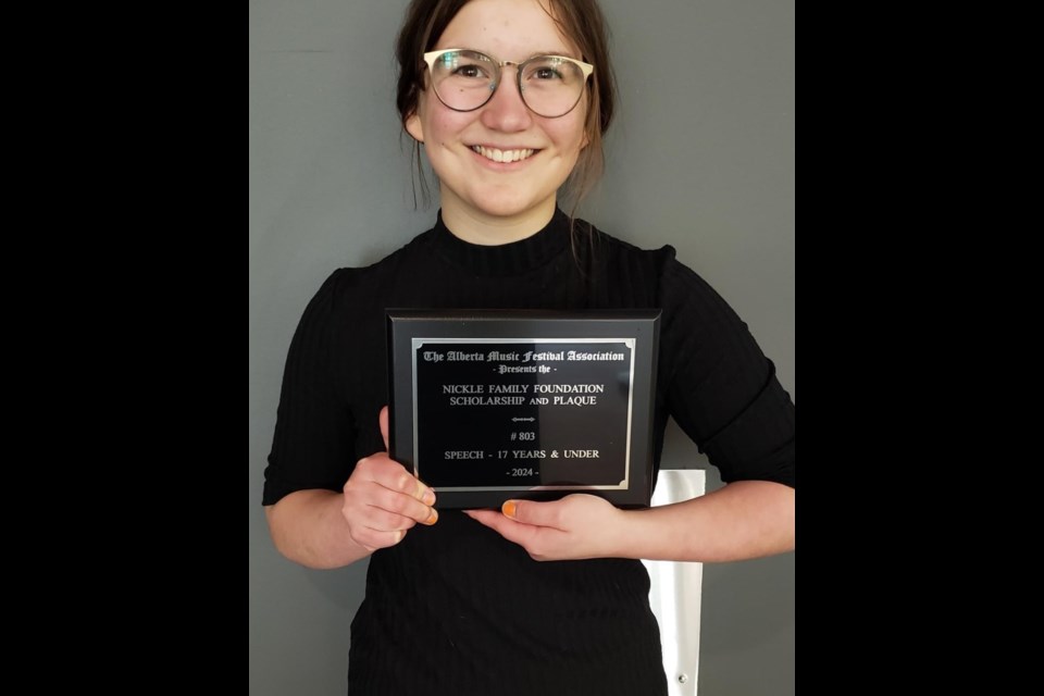 Katie Gascon shows the plaque she received after finishing first in speech, 17 & under during the Provincial Music Festival in Edmonton. Gascon and the Hugh Sutherland School Choir have been recommended to participate in the Canada West Festival, which takes place July 25-27 in Victoria, B.C. 
Submitted photo