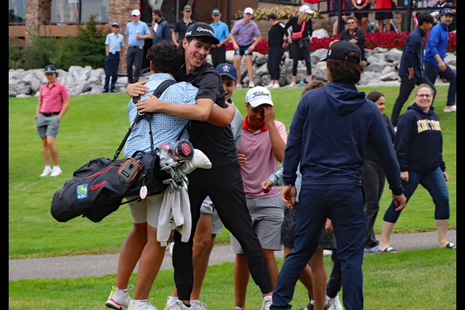 Isaiah Ibit, this year's winner of the 2024 Canadian Junior Boys Championship at the Innisfail Golf Club, is congratulated by fans and tournament officials immediately after finishing his final round. Johnnie Bachusky/MVP Staff