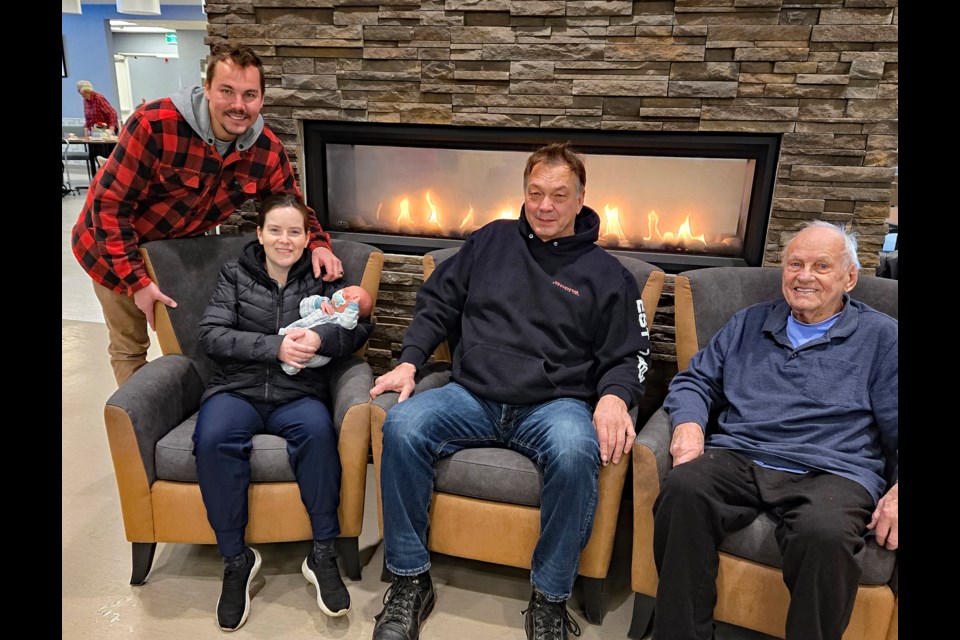 Recovering Nesterchuk family members in Innisfail after their once-in-a-lifetime joint hospital experience in Red Deer on Nov. 13. From left to right is Barry and Bobby-Jo Nesterchuk's son Taylor, his wife Jessica and their new son Maximillian; Doug Nesterchuck, Taylor's uncle, and family patriarch Jim Nesterchuck, father of Doug, grandfather of Taylor and new great-grandfather of Maximillian. Submitted photo