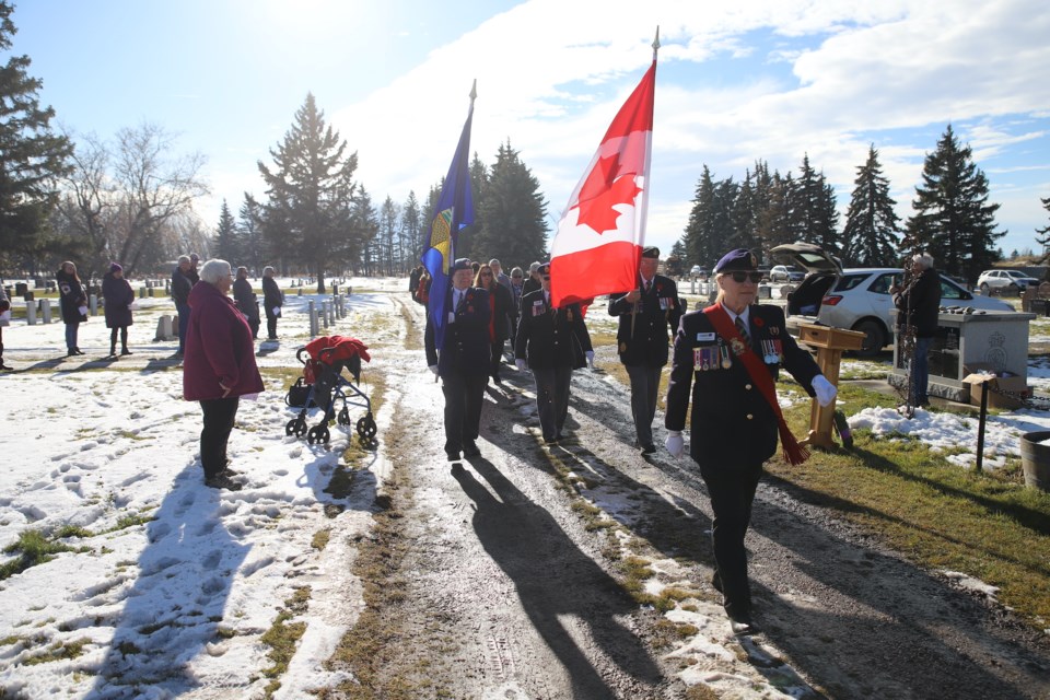 Leslie Manchur of the Royal Canadian Legion Branch 105 leads dignitaries and students in the march to the cenotaph.