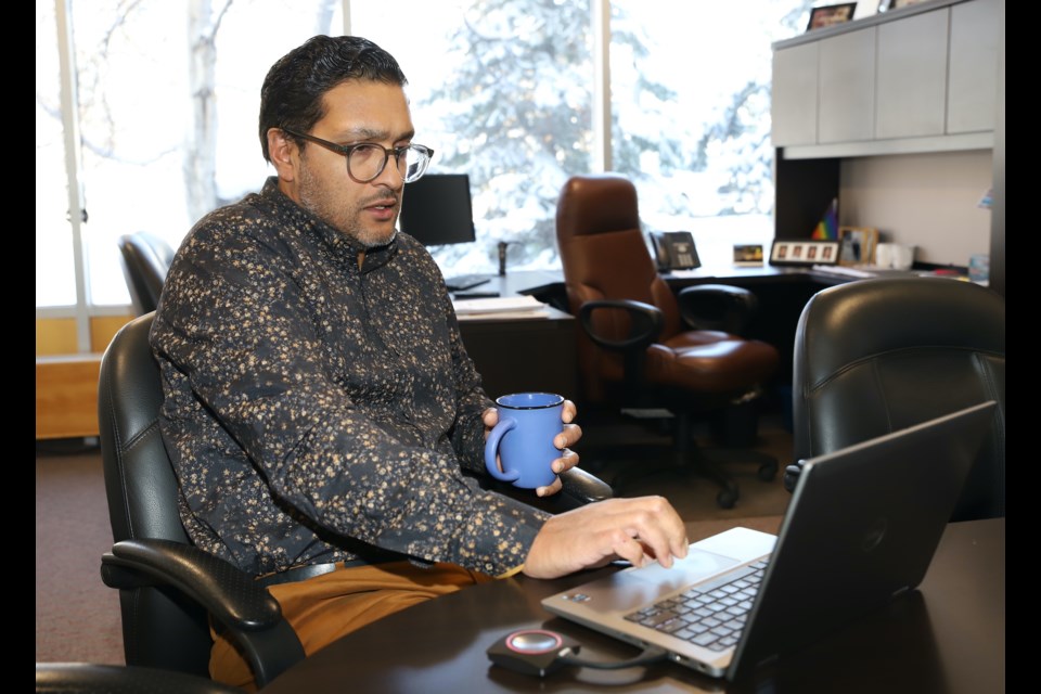 Olds College of Agriculture & Technology vice-president of student experience Peter Mal checks out some stats related to international students enrolled in the institution.