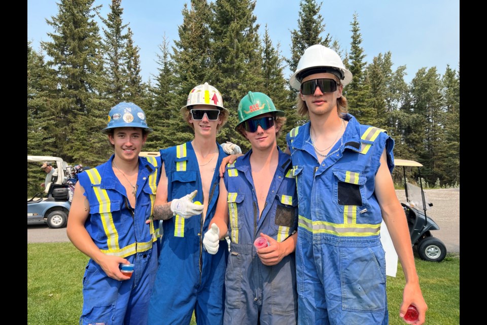 From left: Donning overalls amid some searing summer heat, Tate Lyle, Trace Saunders, Wyatt Thengs, and Evan Smith were among the 140 players who on Saturday, July 20 came out to the Coyote Creek Golf & RV Resort to have some fun on the fairways in the annual Play 4 Sundre Kidz golf tournament fundraiser. The event’s registration had reached its capacity of 144 players, but one team got called away at the last minute for work, said event organizer Nicky Vardas. 
Submitted photo