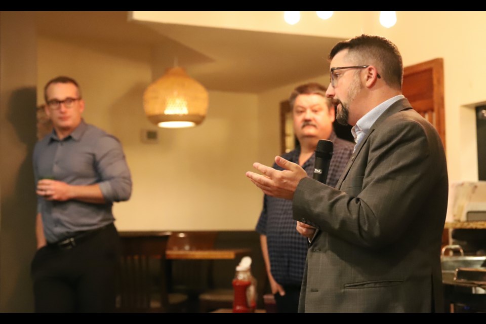 Olds-Didsbury-Three Hills MLA Nathan Cooper answers a question during the the Olds & District Chamber of Commerce’s first-ever Small Business Awards Week kick-off breakfast. Looking on, from left, are Town of Olds chief administrative officer Brent Williams and Olds & District Chamber of Commerce president Doug Rieberger.