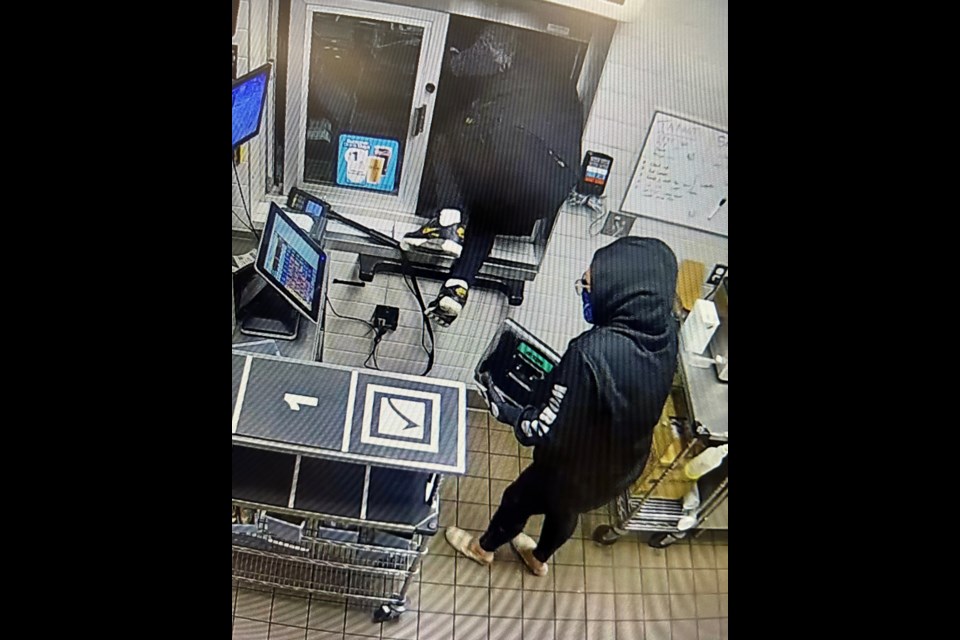 The male and female suspects were captured on surveillance cameras using the drive-through window to break into the Sundre McDonald’s before making off with an undisclosed sum of cash during the early morning hours of Sunday, July 28. 
Police handout