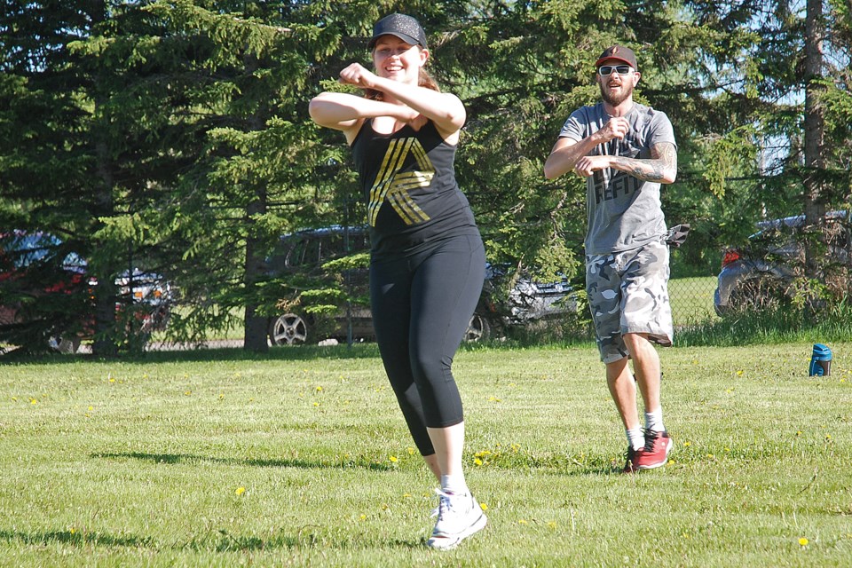 REFIT Sundre participants Ellen Bunn and Jeff Boettger joined on Wednesday, June 10 a group of more than a dozen people who came out to the Sundre Rodeo Grounds for the kick-off to outdoor classes. With all of the available space at the grounds, people easily maintained physical distancing while enjoying some exercise.  
Simon Ducatel/MVP Staff