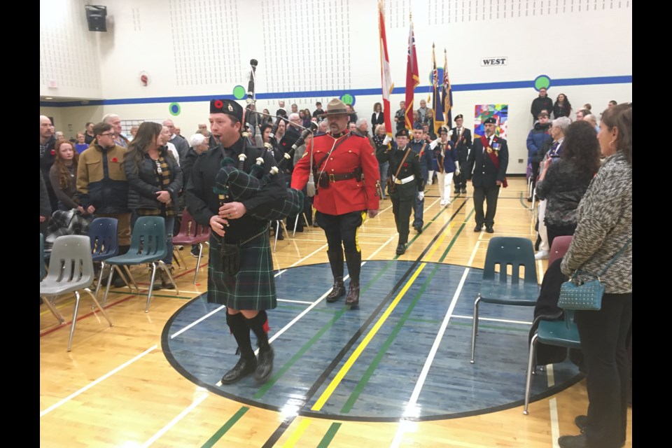 Dale McIntyre, a band piper with the Royal Canadian Legion Branch #104 in Innisfail who is originally from Sundre and lives in Olds, leads the colour party during the Remembrance Day ceremony conducted by the Royal Canadian Legion Branch #223 and hosted at River Valley School in Sundre.
Simon Ducatel/MVP Staff