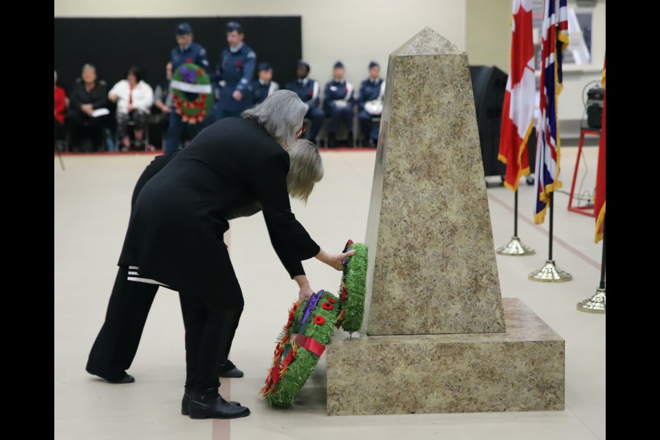 Olds Mayor Judy Dahl, foreground, and Jennifer Lutz, representing Mountain View County, place wreaths at the cenotaph during the indoor Remembrance Day service.
Doug Collie/MVP Staff