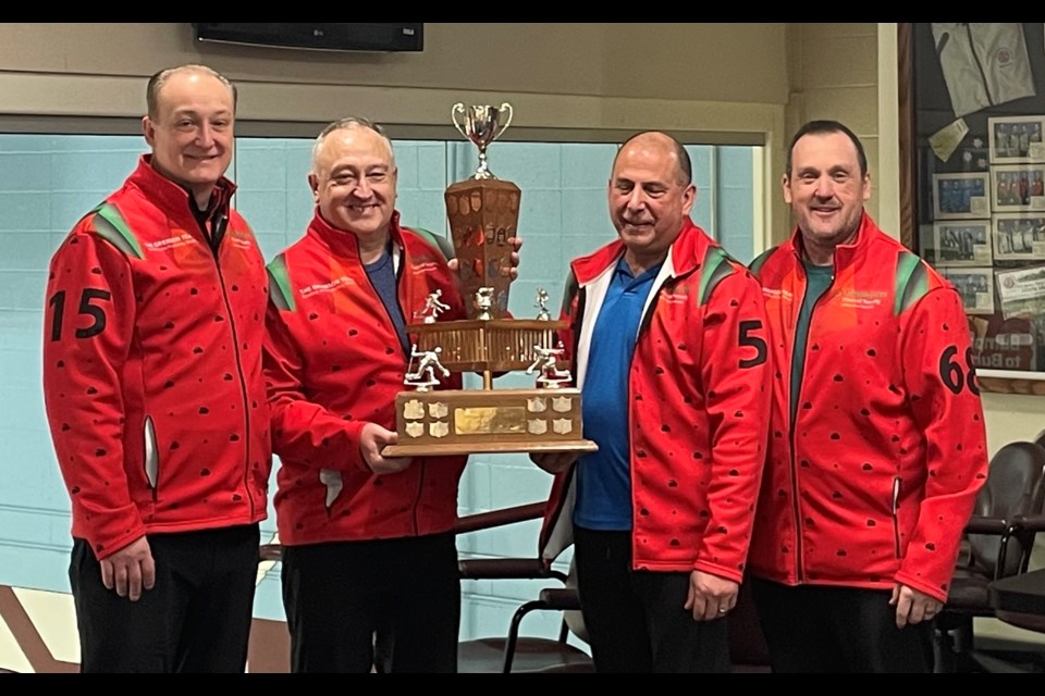 From left, Darren Grierson of Calgary, Collin Georget of Airdrie, as well as Gary Gaudette and Andy Sweetman of Olds, pose with the trophy after winning the the 62nd annual Rotary District 5360/5370 Curling Bonspiel, held Feb. 28-March 2 in the Olds Curling Club.
Photo submitted