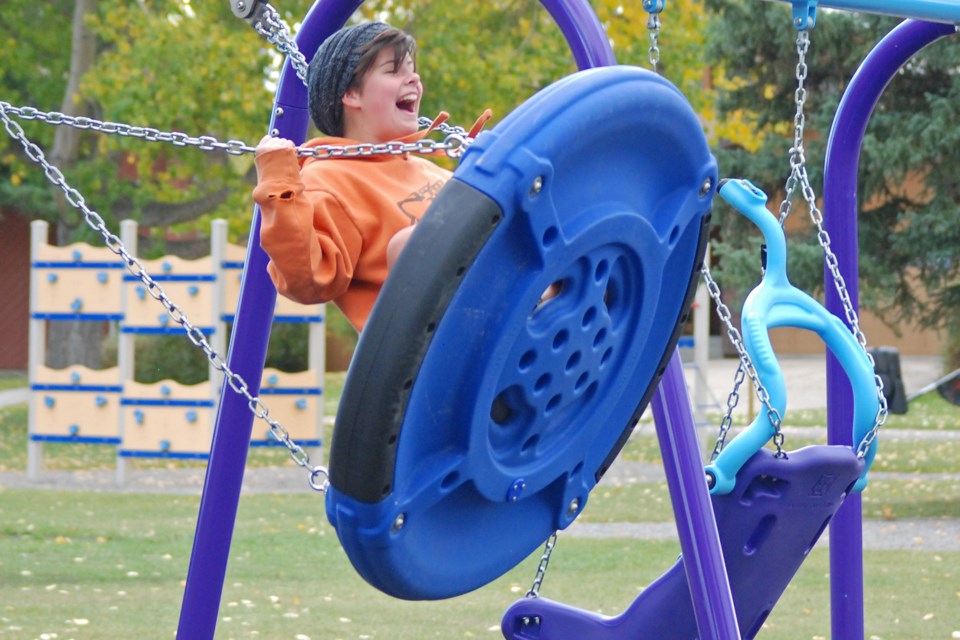 Ella Worth has a blast at the recently completed Royal Purple Park's new playground on Saturday, Sept. 26 as she gets some air courtesy of her friend Sam Johnston, both from Sundre.
Simon Ducatel/MVP Staff