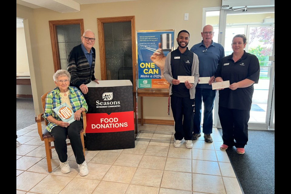  From left, Pat presented Jim a cheque for $600 from sales of the cookbook titled Seasoned With Love
Uta and Rachel presented the cheques to Jim for the $2100.00 Residents Pat Van Tetering and Peter Verhesen Uta (Fun Manager at Seasons Encore), Jim Thompson (Mountain View Food Bank contact and a resident at Seasons Encore) and Rachel Verhaeghe (Fun Manager at Seasons Olds) 



