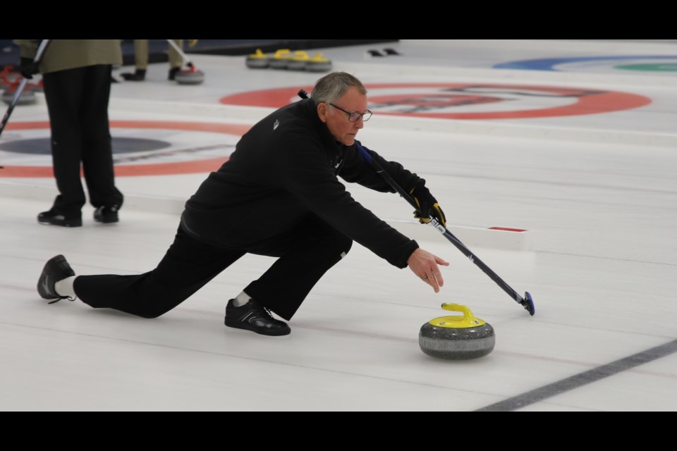 Greg Compton throws a rock during the Olds Curling Club's Seniors Bonspiel.
Doug Collie/MVP Staff