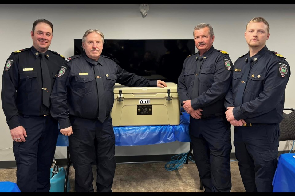 From left: Sundre Fire Department members David Bennett, Darryl Murphy, Chief Ross Clews, and Alex Clews were among those who back in January gathered at the fire hall to recognize career milestones. Both the chief and Murphy earned long-service medals awarded to members who have served for at least 30 years.  
Sundre Fire Rescue Society Facebook