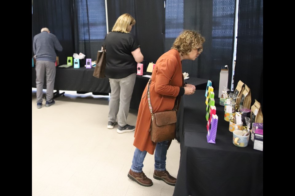 Attendees at the banquet check out the silent auction.
Doug Collie/MVP Staff