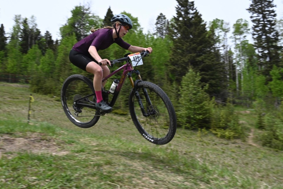 Aida Morrison briefly goes airborne as she shoots away from the halfpipe feature on Snake Hill. Morrison was among a little more than 100 cyclists who on Saturday, June 1 competed in the Snake Hill Slither, which was held in Sundre for the fourth year in a row. Photo courtesy of Evan Harbinson