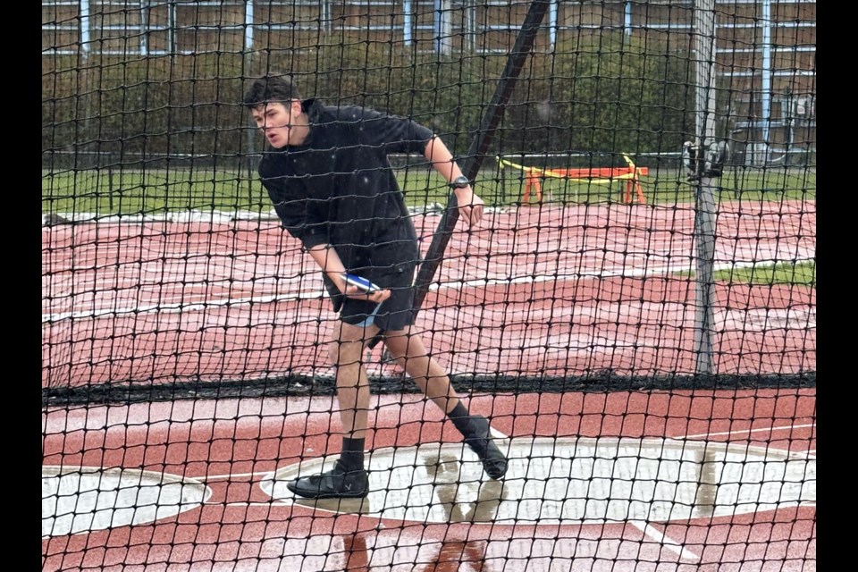 Jett Rosch gets ready to throw the discus during very wet competition conditions.
Photo submitted