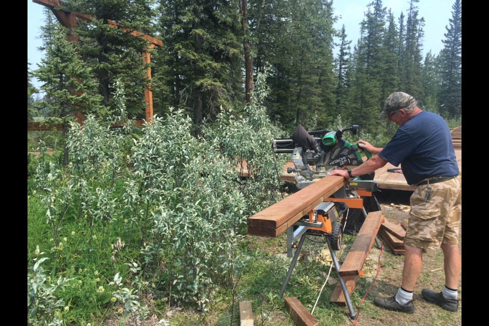 Dave Formstone, who is among the volunteer crew of about half a dozen, keeps the cuts of wood coming along while other hands were working on extending the boardwalk.
Simon Ducatel/MVP Staff