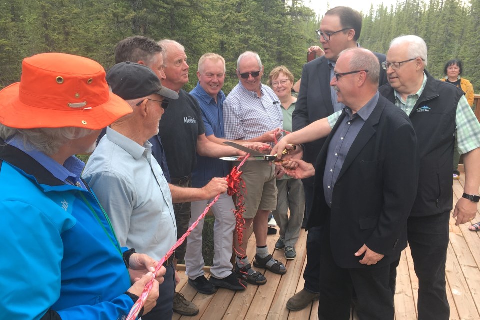 Sundre mayor Richard Warnock, right, was joined by Rimbey-Rocky Mountain House-Sundre riding MLA Jason Nixon and minister of Municipal Affairs Ric McIver on Friday, June 14 during a grand opening and ribbon cutting ceremony for the interpretive and educational nature boardwalk on the east side of town that can be accessed courtesy of a wheelchair and stroller friendly ramp over the berm behind the Visitor Information Centre. 
Simon Ducatel/MVP Staff