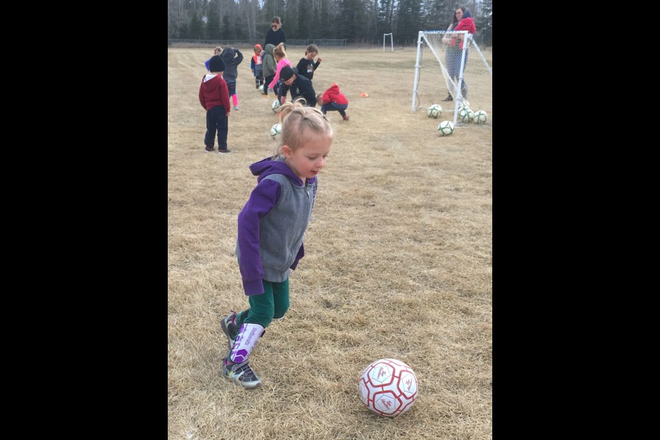 Three-year-old Emery Warren learns to kick a soccer ball at the fields in Sundre's southeast immediately adjacent Highway 760 or the Bergen Road near the Royal Canadian Legion Sundre Branch #223.
Simon Ducatel/MVP Staff