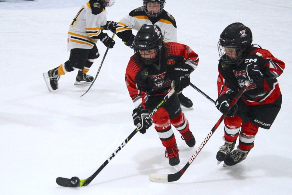 Sundre U9 Huskies Black player Jordan Carroll works the puck out of his team’s zone with Luke Hannah on his flank on Friday, Feb. 7 at the Sundre Arena during the opening game of their home tournament in a match against the Olds Grizzlies.
Simon Ducatel/MVP Staff