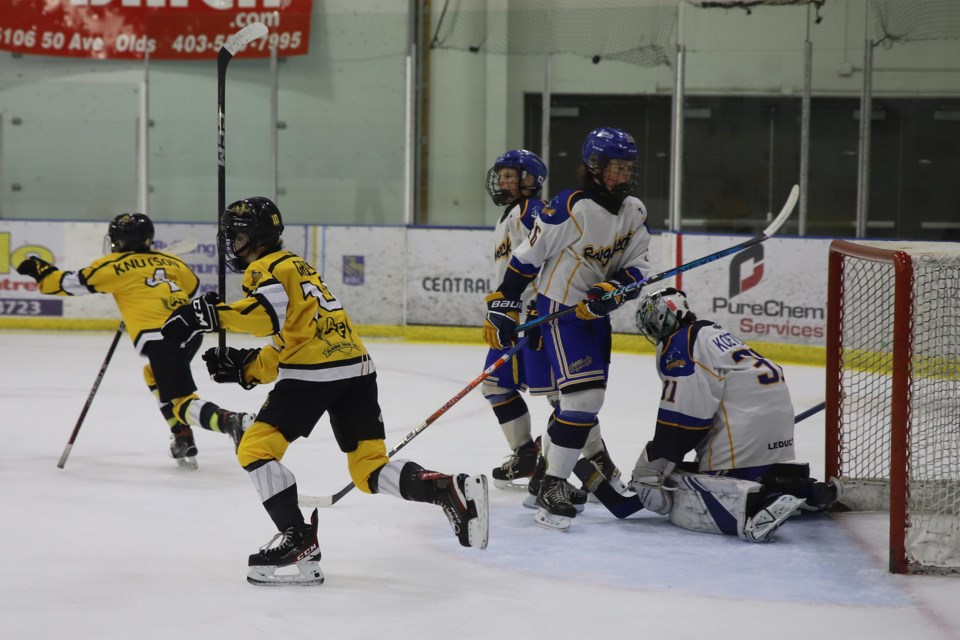 Olds Grizzlys players Kallen Knutson (4) and Matteo Grieco (10) celebrate after a powerplay goal is scored against the Leduc Roughnecks duriing the U-13AA provincials.
Doug Collie/MVP Staff