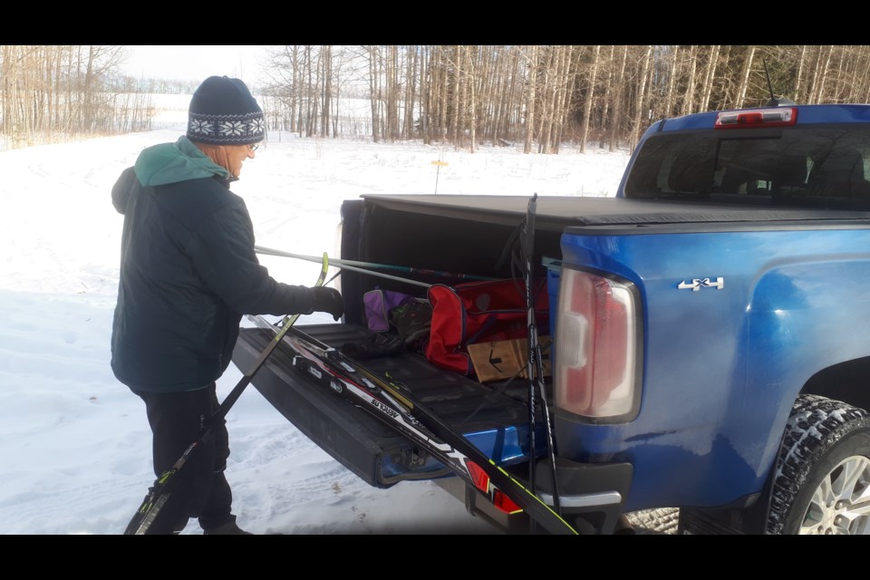 Warren Smith unloads ski equipment at the site of our little cross-country skiing adventure at Trail Creek.