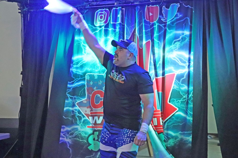 Hayden Avery makes his grand entrance to the ring amidst bright colourful lights and loud music for his CanAm World Tag Team Championship match in Innisfail on Jan. 17. Johnnie Bachusky/MVP Staff