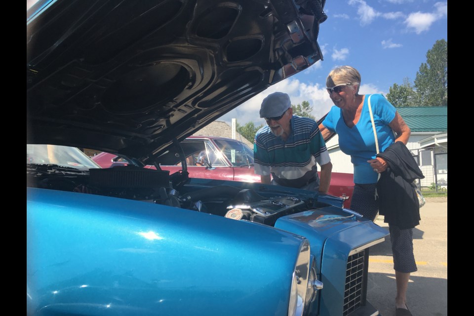 This morning before some rain swept through the area early in the afternoon, folks were beaming smiles almost as bright as the vehicles they were admiring under sunny blue skies. 
Simon Ducatel/MVP Staff