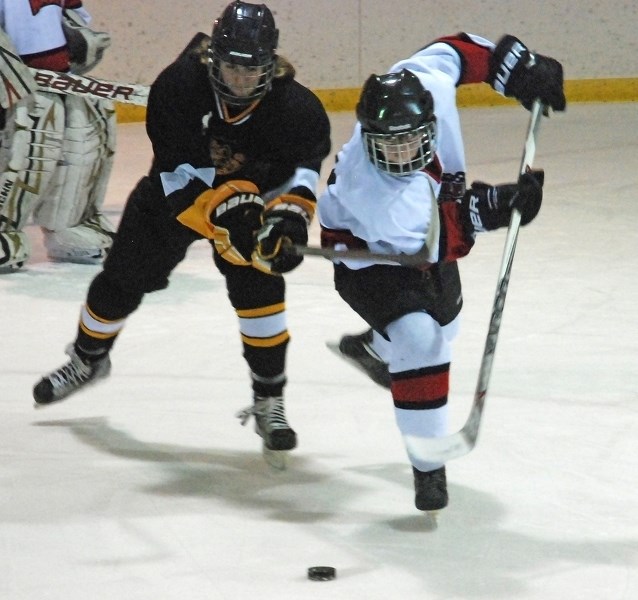 Sundre midget Husky Lucas Vancuren vies for control of the puck during first period action of the second provincial playdown round against Hanna on home ice on Friday, Feb.