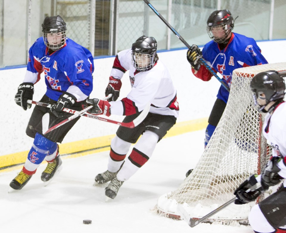 The Sundre midget Huskies battle the Eckville Eagles at the Sundre Arena on Friday, March 18 during Game 2 of the North Central Minor Hockey Association&#8217;s league final.,