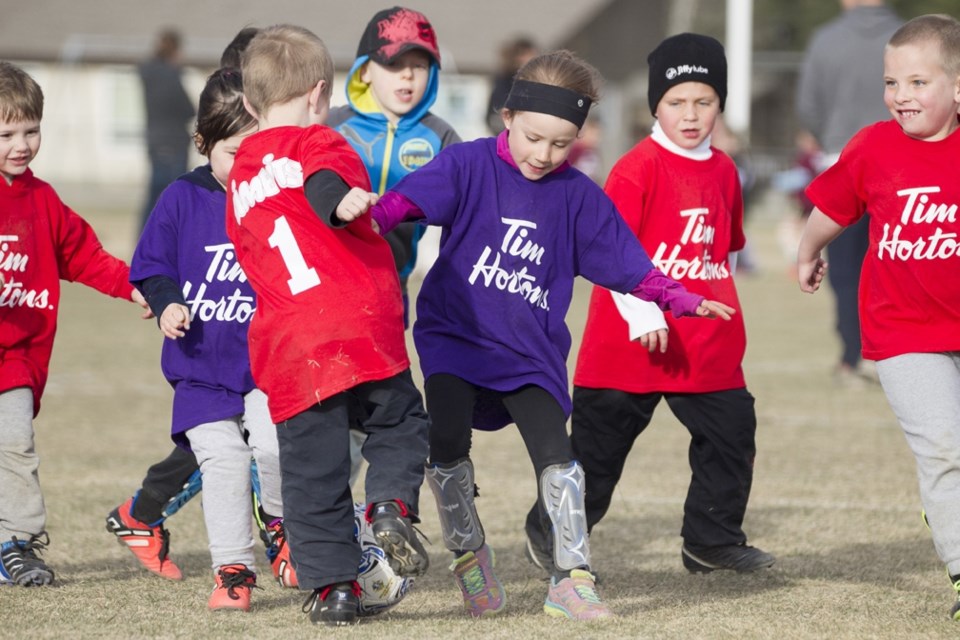 MINOR SOCCER KICKS OFF ó The Sundre minor soccer U-6 team purple and team red players scrimmage during a practice next to Sundre High School on Tuesday, April 12.,