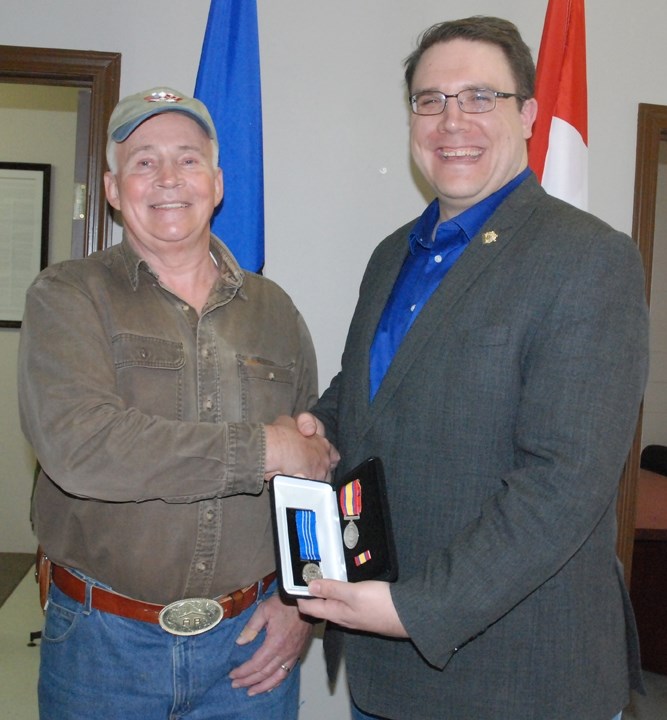 RECOGNITION OF SERVICE AWARD ó Late last month at the Sundre constituency office Rimbey-Rocky Mountain House-Sundre MLA Jason Nixon presented Murray Bates with a Long Service 